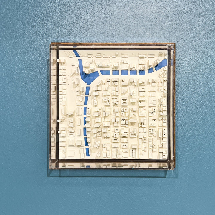 3D map of Chicago with a dark frame, acrylic case and blue water