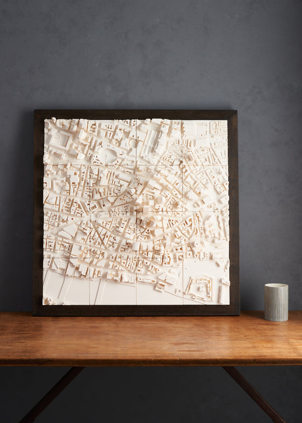 Large format London cityscape with a dark frame leaning against a wall