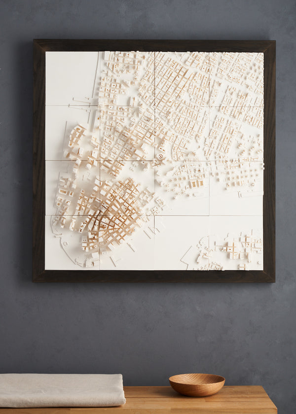 Large format New York cityscape with a brown frame on a grey wall
