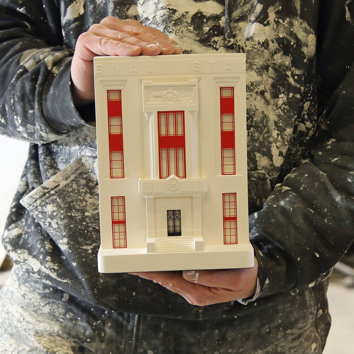 Arsenal's Highbury Stadium architectural scale facade model being held up
